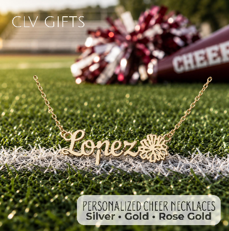 Gold-tone personalized cheer necklace with a pom-pom motif on a football field.