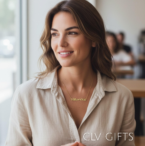 Woman in a beige blouse wearing a personalized soccer necklace in a cafe.
