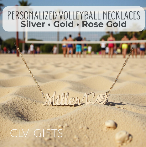 Personalized Miller12 necklace with a volleyball motif on sand beside a beach volleyball court.